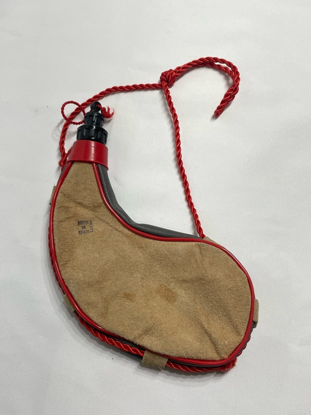 traditional Spanish bota bag wineskin designed to carry wine or water while trav